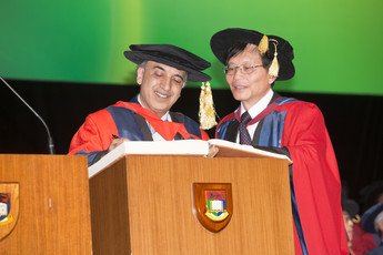 Mr Justice Syed Kemal Shah BOKHARY signs the Register of the Honorary Degree Graduates