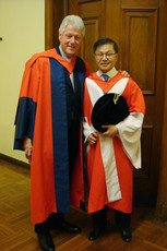 The Honorable William Jefferson CLINTON and Dr David HO Da I