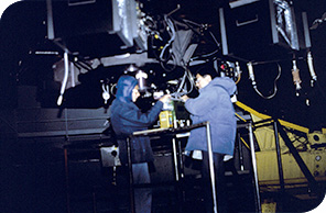 Professor Sun Kwok and his student Rita Boreiko working on an instrument in the dome of the Canada-France-Hawaii Telescope