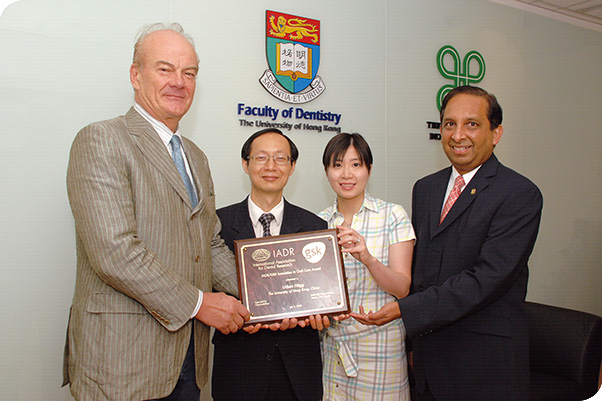 Dr Ricky Wong (second from the left) receives funding for the ‘prune mouthwash project’, with (from left to right) Professor Hagg, the then-Chair of Orthodontics, Dr Michelle Yuen, an MOrth student for part of the prune project, and Professor Samaranayake, Dean of the Faculty of Dentistry.