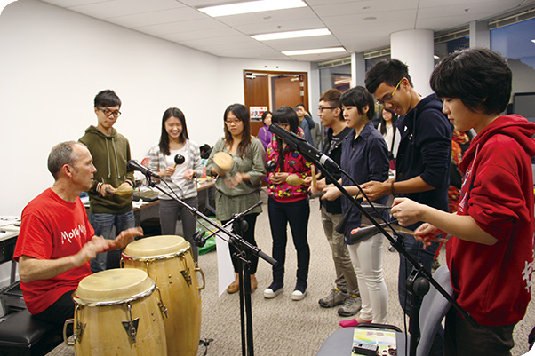 Peter Moser (far left) is joined by students getting ready to perform his newly-written songs