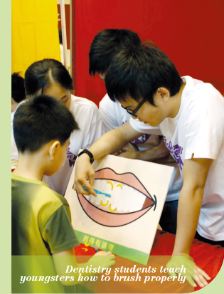 Dentistry students teach youngsters how to brush properly