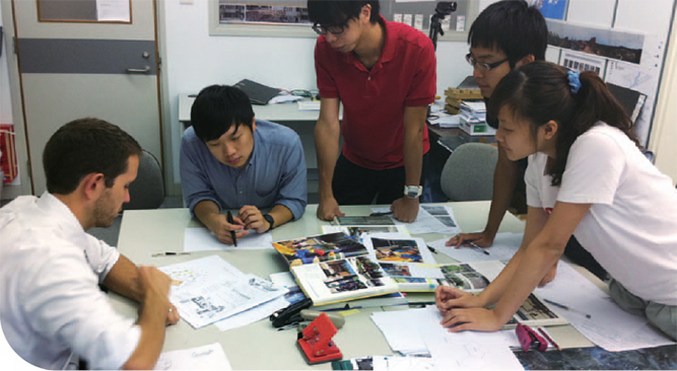 Architecture students work on plans